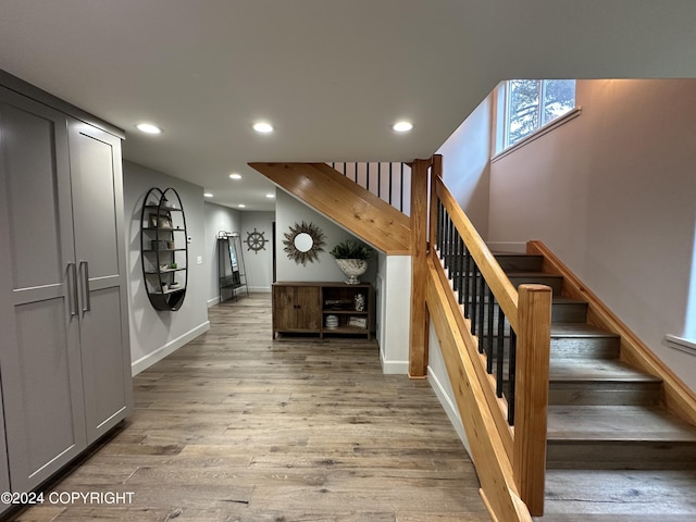 345 C St, Seldovia, AK 99663 - stairway with baseboards, wood finished floors, and recessed lighting
