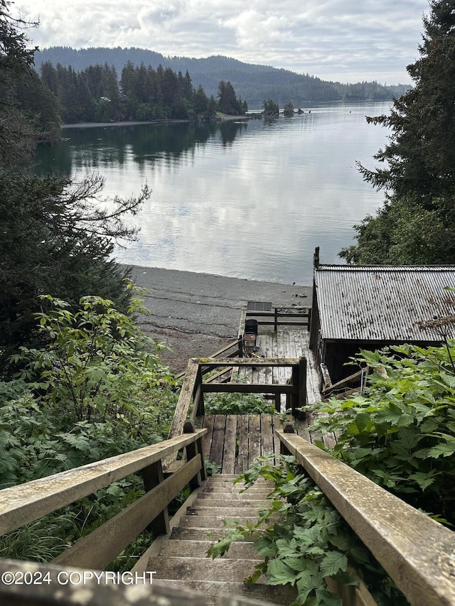 345 C St, Seldovia, AK 99663 - view of dock featuring a water view and a view of trees