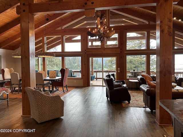 345 C St, Seldovia, AK 99663 - living room featuring an inviting chandelier, wooden ceiling, dark wood-style floors, and beam ceiling
