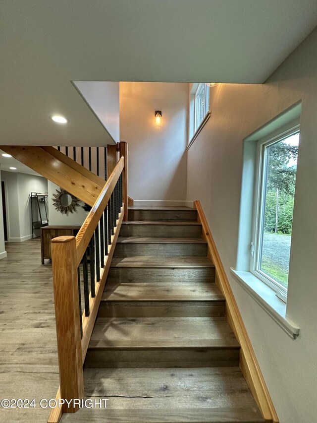 345 C St, Seldovia, AK 99663 - stairway featuring baseboards, wood finished floors, and recessed lighting