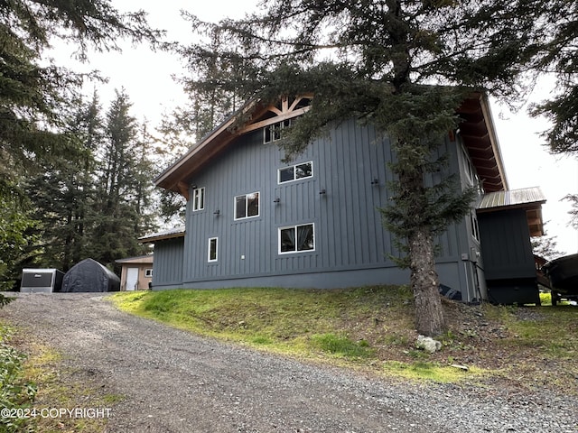 345 C St, Seldovia, AK 99663 - view of side of home featuring a garage and board and batten siding