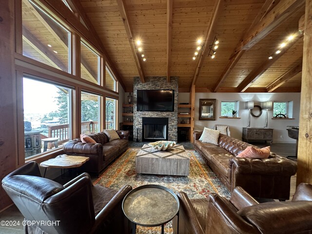 345 C St, Seldovia, AK 99663 - living room with rail lighting, high vaulted ceiling, wood ceiling, beamed ceiling, and a fireplace