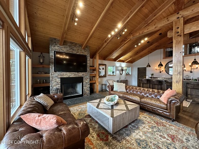 345 C St, Seldovia, AK 99663 - living room featuring wood ceiling, a stone fireplace, high vaulted ceiling, and wood finished floors