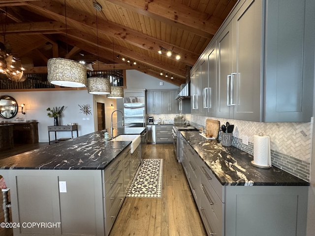 345 C St, Seldovia, AK 99663 - kitchen with decorative backsplash, a sink, wood ceiling, light wood-style floors, and high end appliances