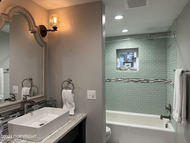 345 C St, Seldovia, AK 99663 - bathroom featuring toilet, vanity, washtub / shower combination, visible vents, and recessed lighting
