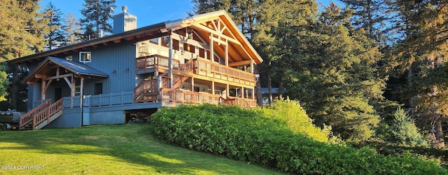 345 C St, Seldovia, AK 99663 - rear view of property featuring stairway, a yard, and a chimney