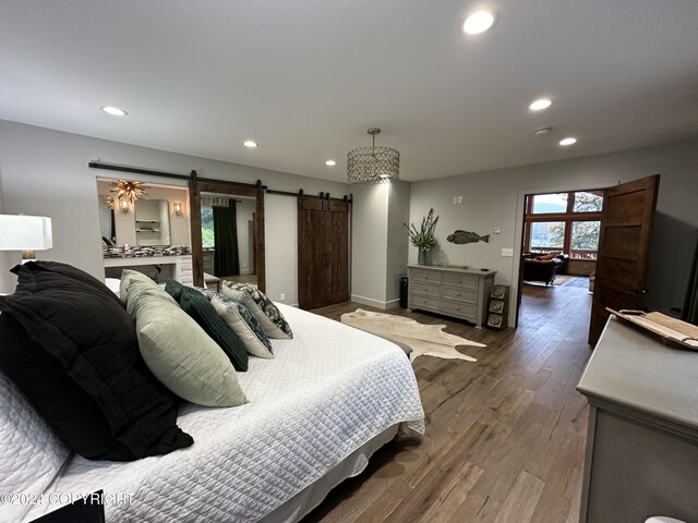 345 C St, Seldovia, AK 99663 - bedroom featuring baseboards, a barn door, wood finished floors, and recessed lighting