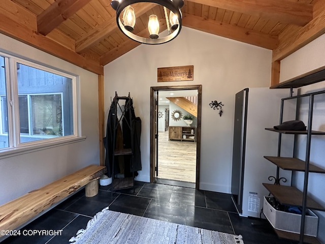345 C St, Seldovia, AK 99663 - interior space with lofted ceiling with beams, dark tile patterned flooring, baseboards, and wooden ceiling