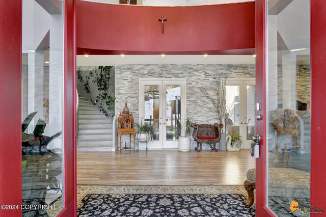 8100 Sky Mountain Ln, Anchorage, AK 99502 - entrance foyer featuring french doors and wood finished floors