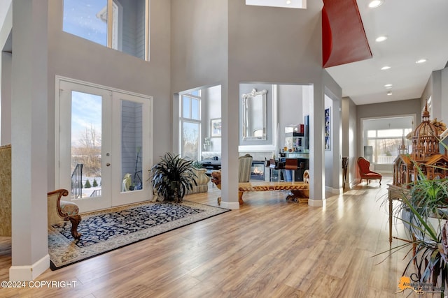 8100 Sky Mountain Ln, Anchorage, AK 99502 - foyer featuring wood finished floors, baseboards, french doors, a high ceiling, and recessed lighting