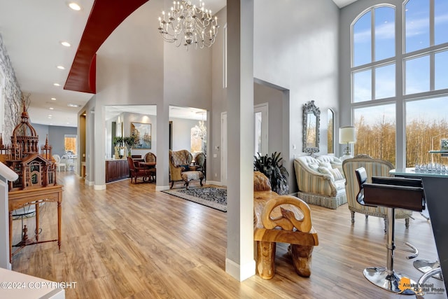 8100 Sky Mountain Ln, Anchorage, AK 99502 - entrance foyer featuring a high ceiling, a chandelier, wood finished floors, recessed lighting, and baseboards