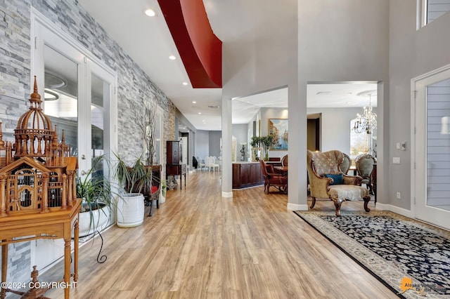 8100 Sky Mountain Ln, Anchorage, AK 99502 - entryway with wood finished floors, a chandelier, plenty of natural light, recessed lighting, and a high ceiling