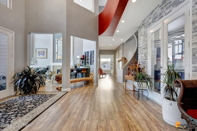 8100 Sky Mountain Ln, Anchorage, AK 99502 - entryway featuring light wood-style flooring, a high ceiling, and recessed lighting