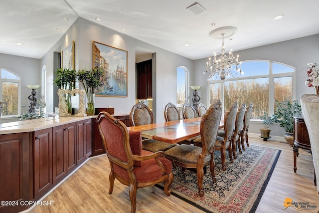 8100 Sky Mountain Ln, Anchorage, AK 99502 - dining room featuring light wood finished floors, a chandelier, and recessed lighting
