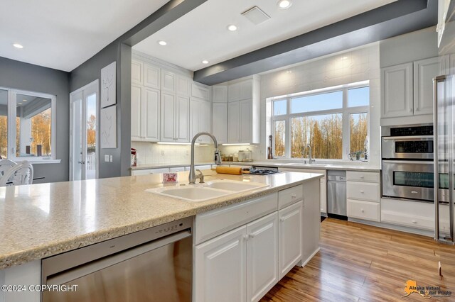 8100 Sky Mountain Ln, Anchorage, AK 99502 - kitchen featuring a sink, appliances with stainless steel finishes, white cabinets, and recessed lighting