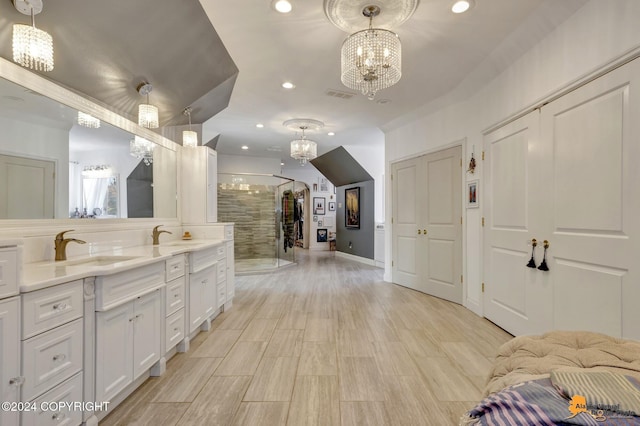 8100 Sky Mountain Ln, Anchorage, AK 99502 - full bathroom featuring a chandelier, a stall shower, double vanity, recessed lighting, and wood finished floors
