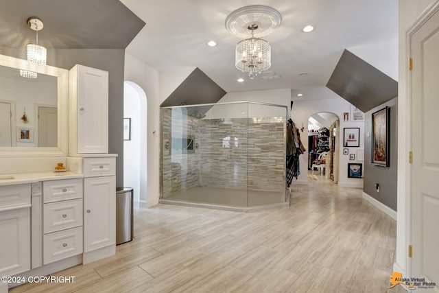 8100 Sky Mountain Ln, Anchorage, AK 99502 - full bathroom with a shower stall, vanity, baseboards, a chandelier, and lofted ceiling
