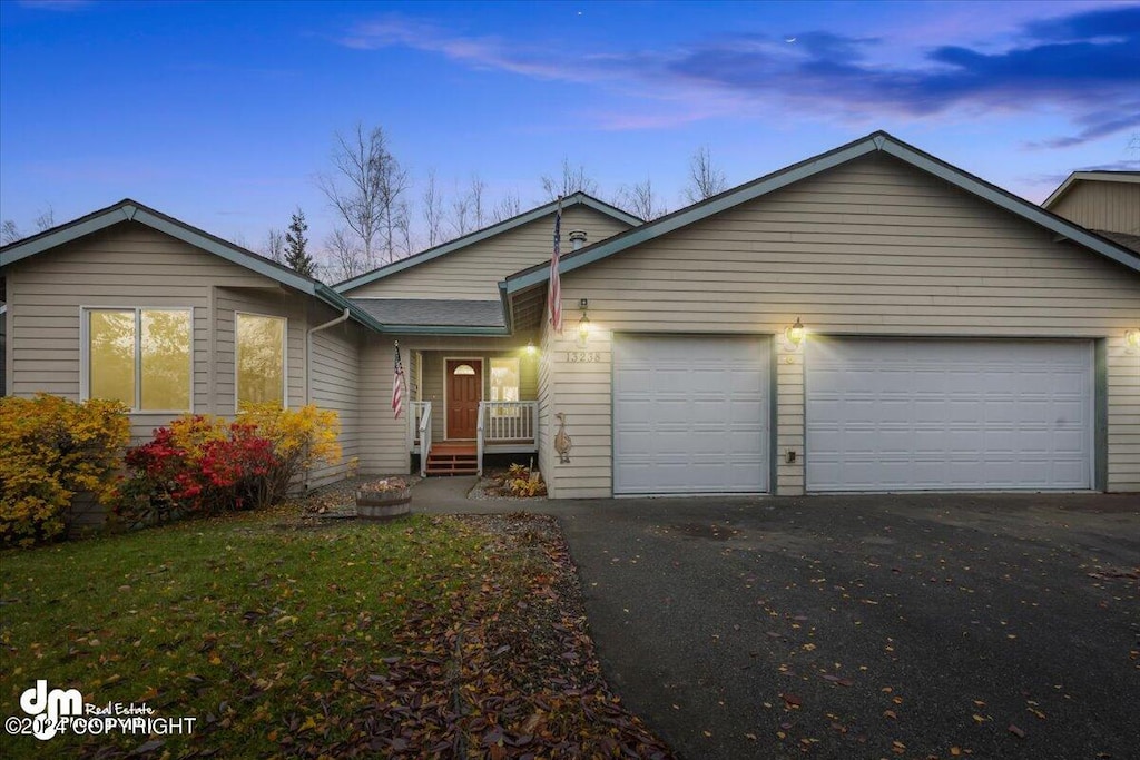 single story home with a garage