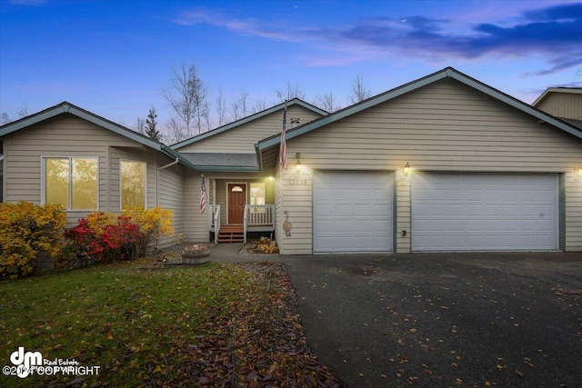 single story home with a garage