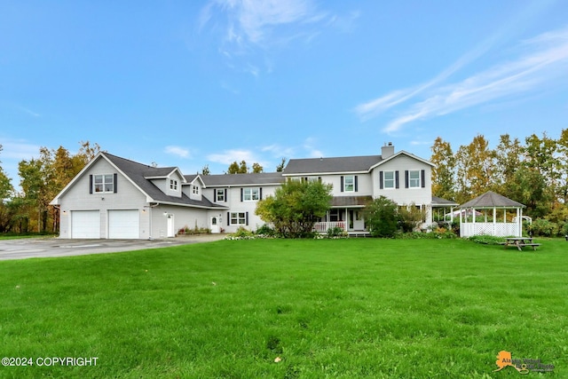 view of front facade with a front lawn and a porch