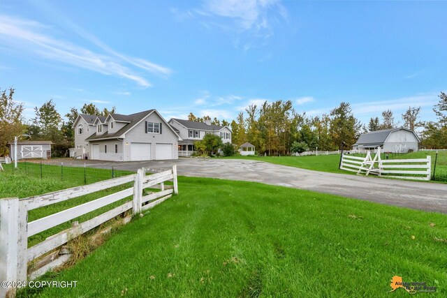 exterior space with a garage and a front yard