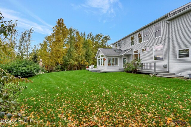 view of yard with a deck