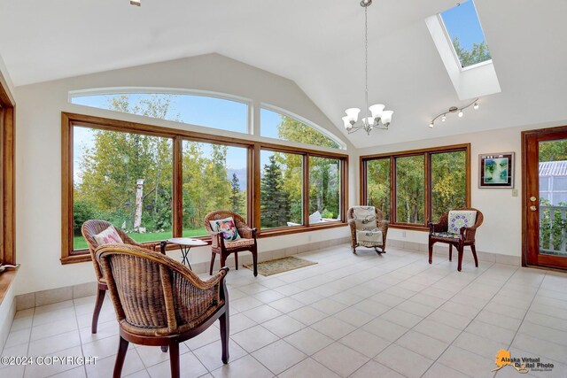 interior space featuring lofted ceiling with skylight, light tile patterned floors, and a wealth of natural light