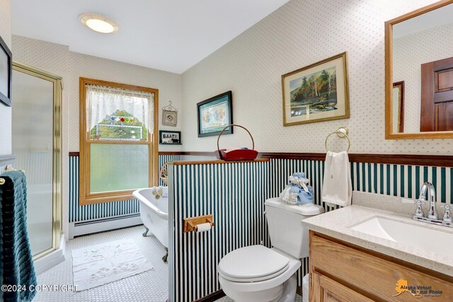 full bathroom featuring vanity, baseboard heating, independent shower and bath, toilet, and tile patterned floors