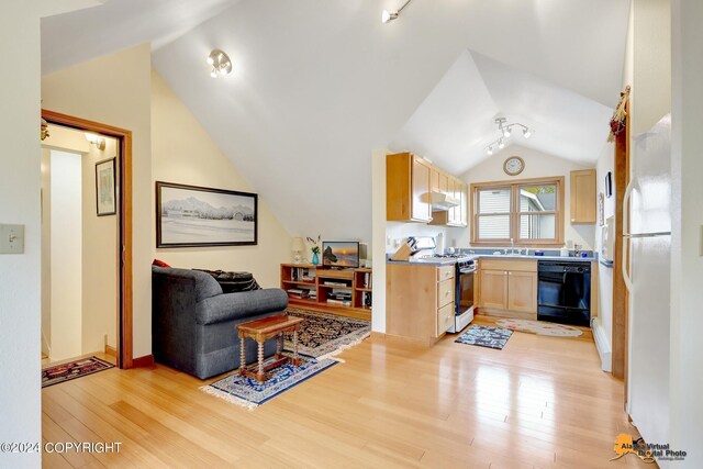 kitchen featuring lofted ceiling, light hardwood / wood-style floors, dishwasher, and white gas stove