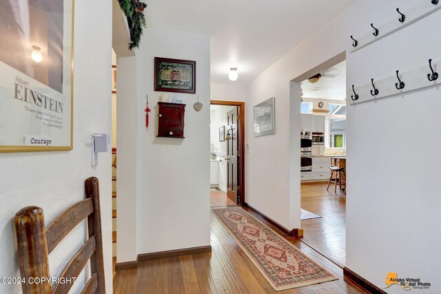 corridor featuring hardwood / wood-style flooring