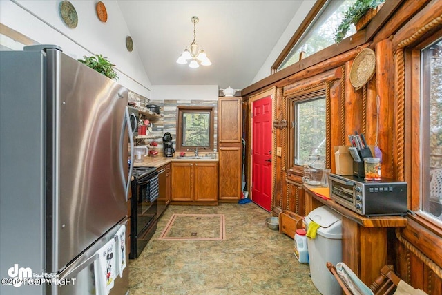 kitchen with sink, black electric range, stainless steel refrigerator, an inviting chandelier, and vaulted ceiling