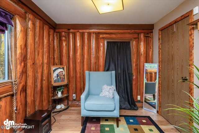 sitting room featuring light hardwood / wood-style floors