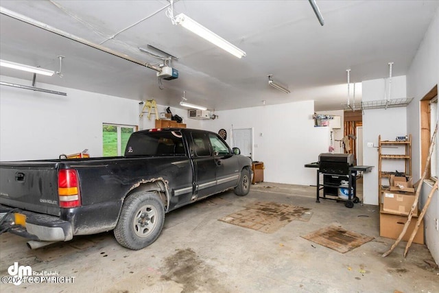 garage featuring a garage door opener