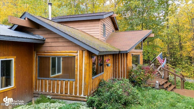 view of home's exterior featuring a deck