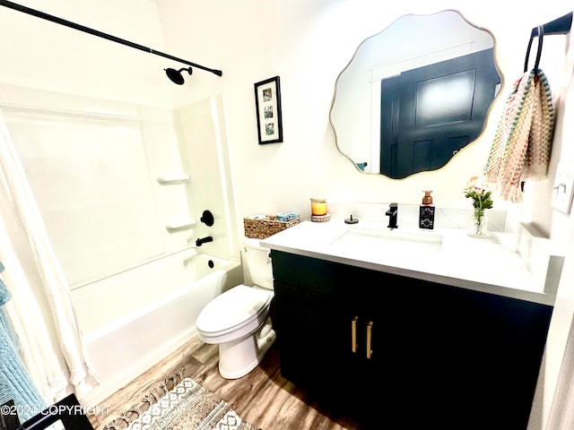 full bathroom with toilet, hardwood / wood-style floors, vanity, and shower / tub combo with curtain