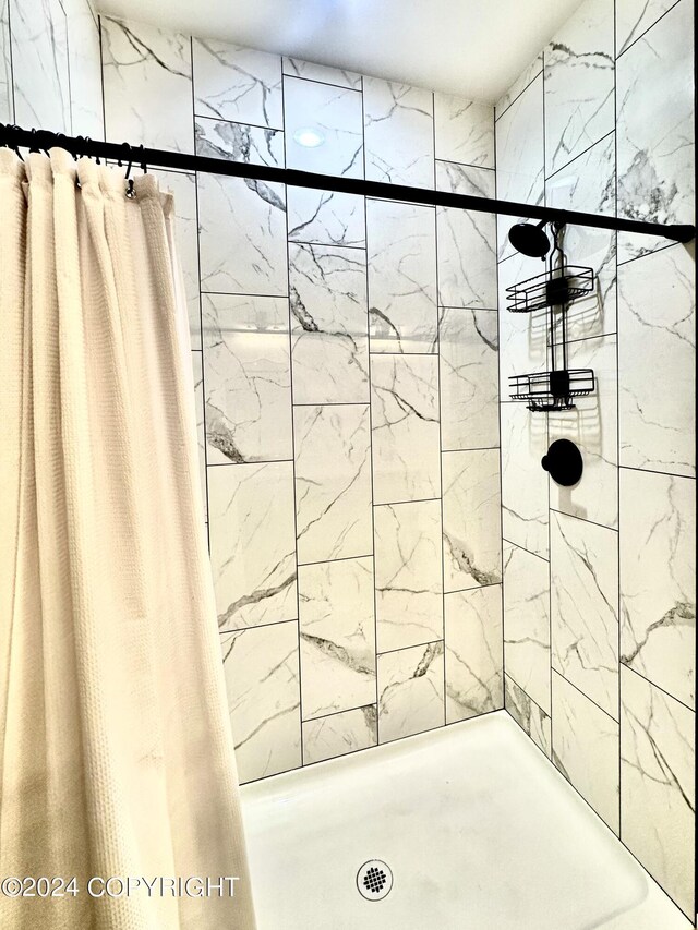 bathroom with a shower with shower curtain