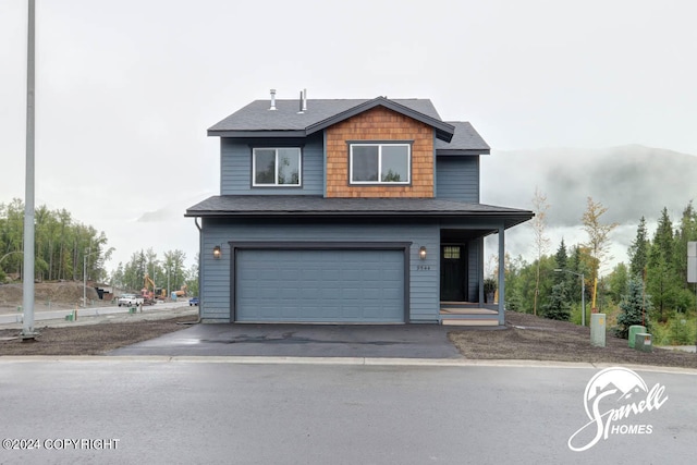 view of front of home featuring a garage and a porch