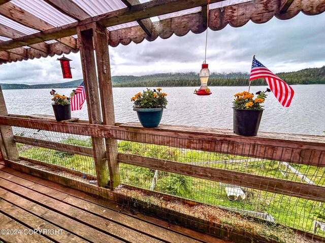 wooden terrace with a water view