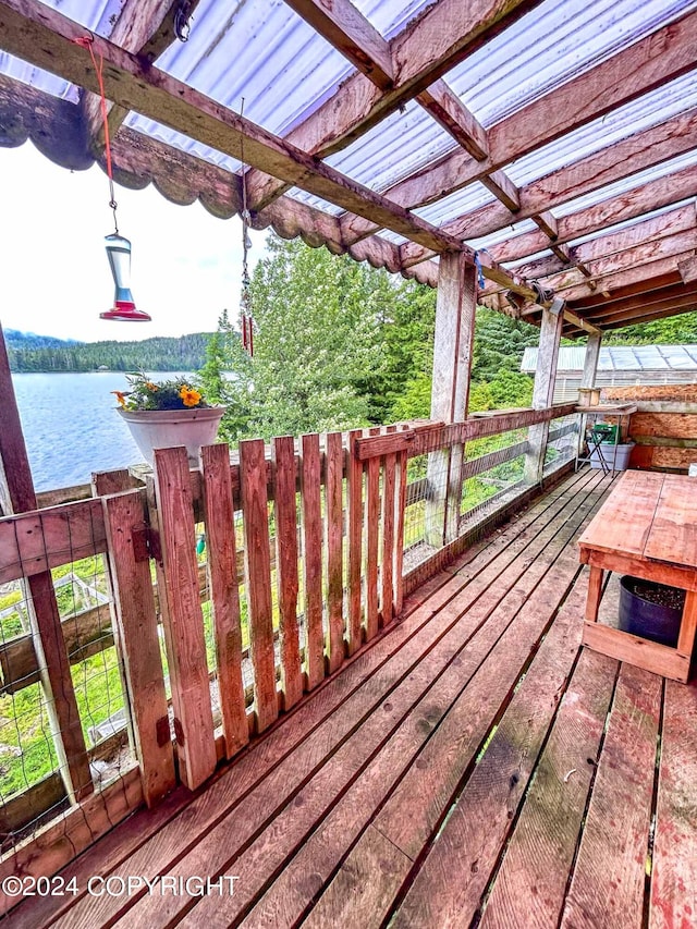 wooden terrace with a water view