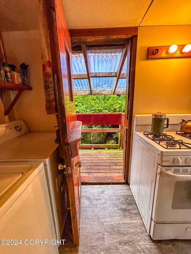 interior space featuring washer / dryer, a textured ceiling, and carpet