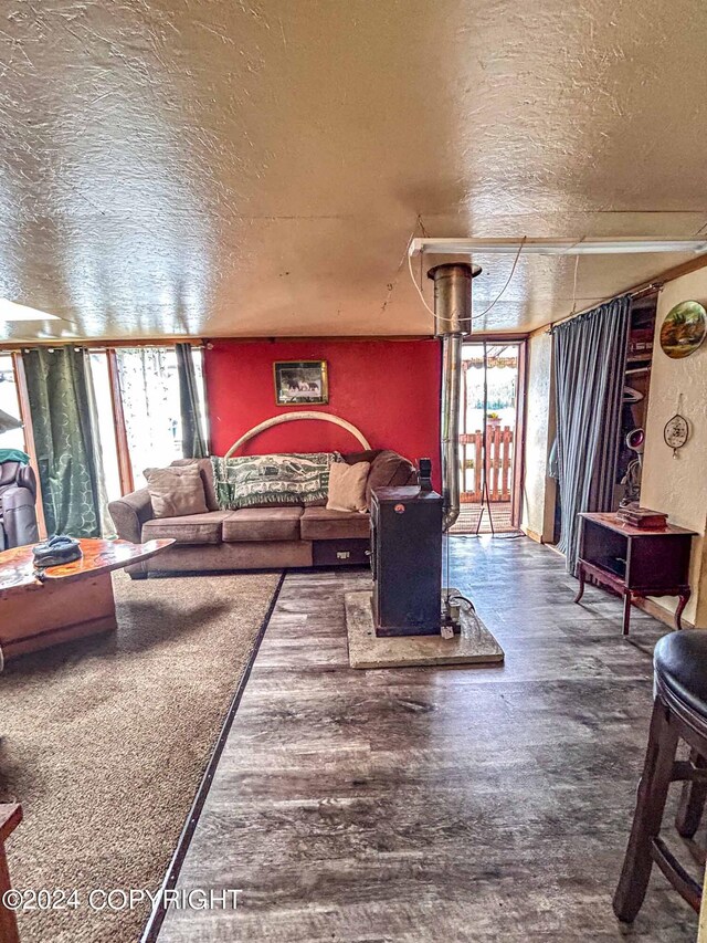 living room featuring floor to ceiling windows and a textured ceiling