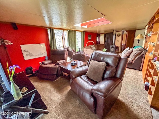 home theater room with a textured ceiling and carpet floors