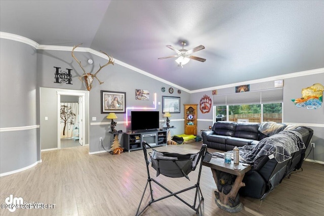 living room featuring ornamental molding, vaulted ceiling, hardwood / wood-style floors, and ceiling fan