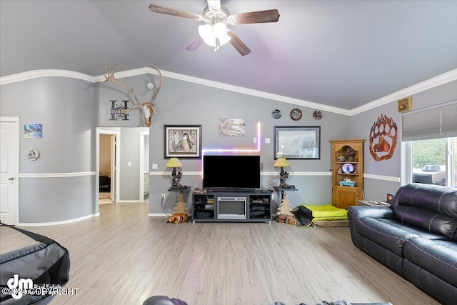 living room with light hardwood / wood-style flooring, ceiling fan, crown molding, and vaulted ceiling