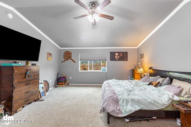 bedroom with ceiling fan, ornamental molding, vaulted ceiling, and carpet floors