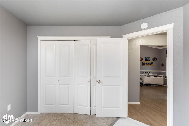 interior space with a closet and light hardwood / wood-style floors