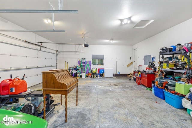 garage featuring electric panel and a garage door opener