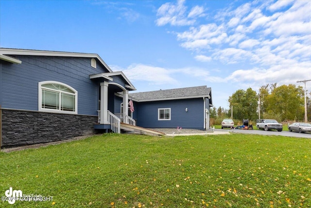 view of property exterior with a yard