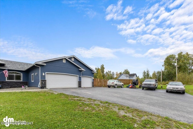 view of front facade featuring a garage and a front lawn