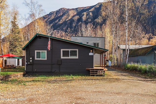 rear view of house with a mountain view